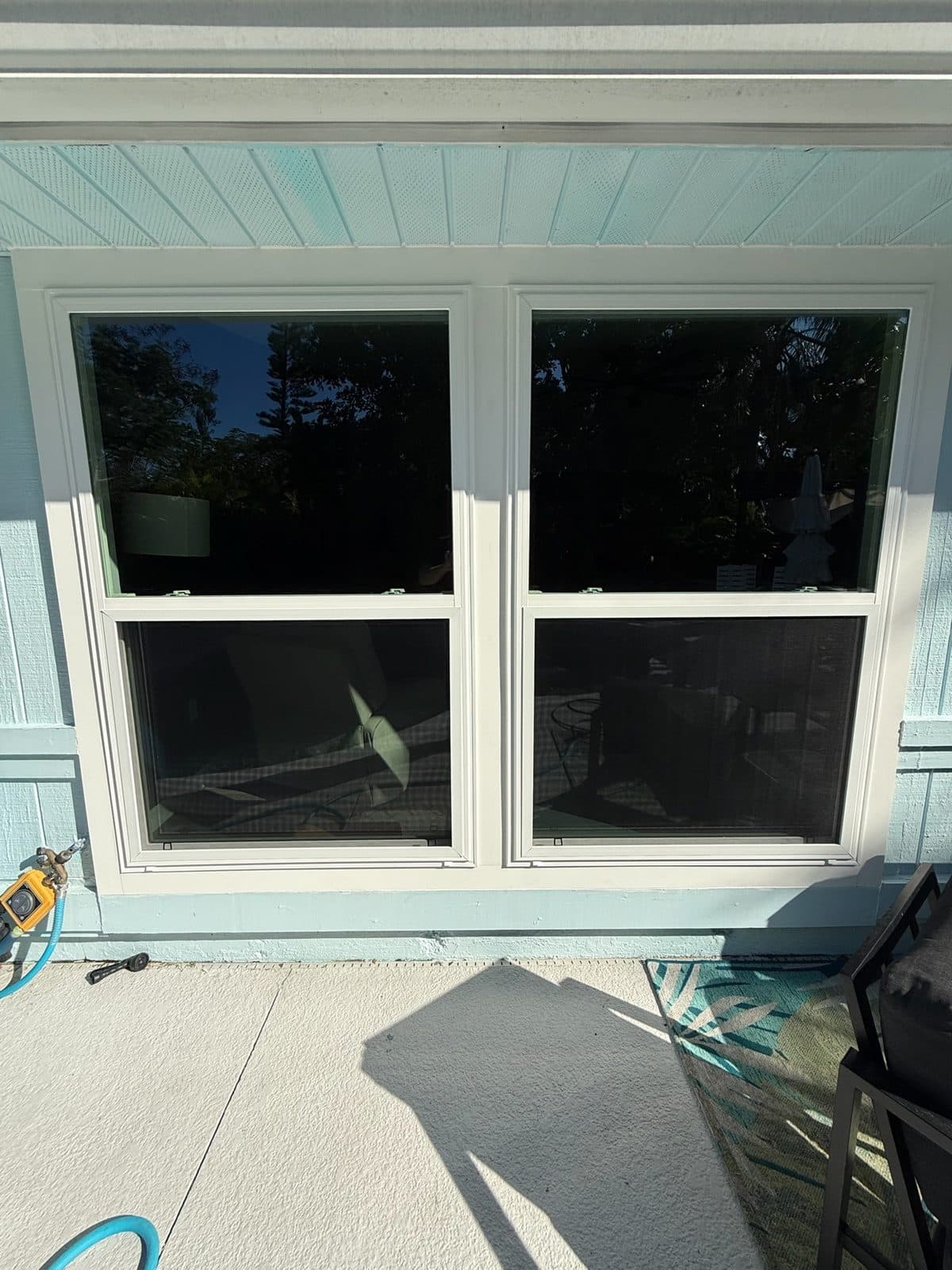 New double-hung windows facing the pool deck of a Sarasota home