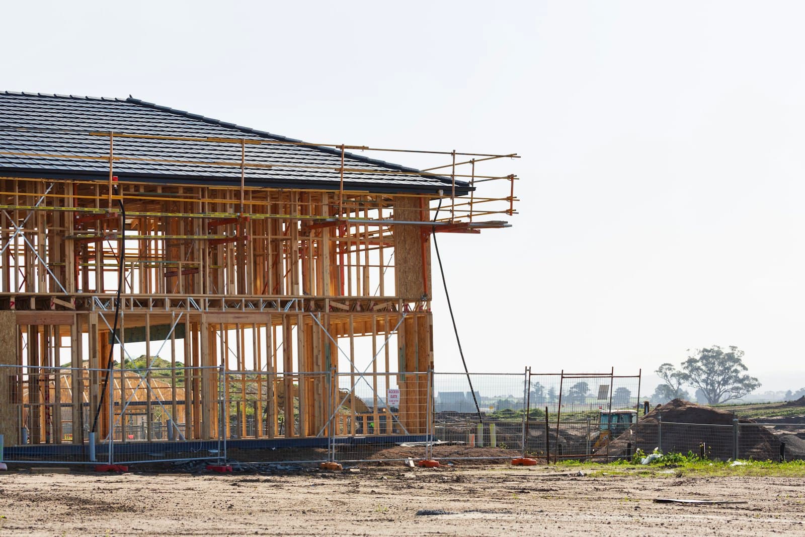 House under construction with scaffolding around the new structure