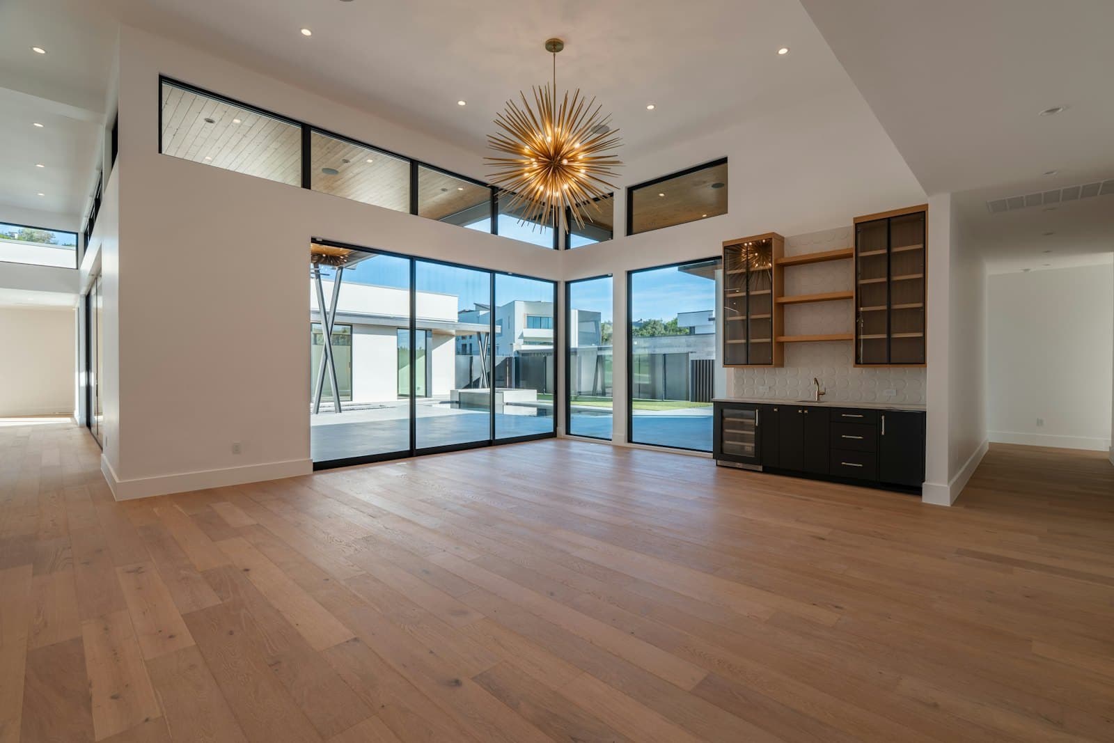 Spacious room with wood floors and large windows