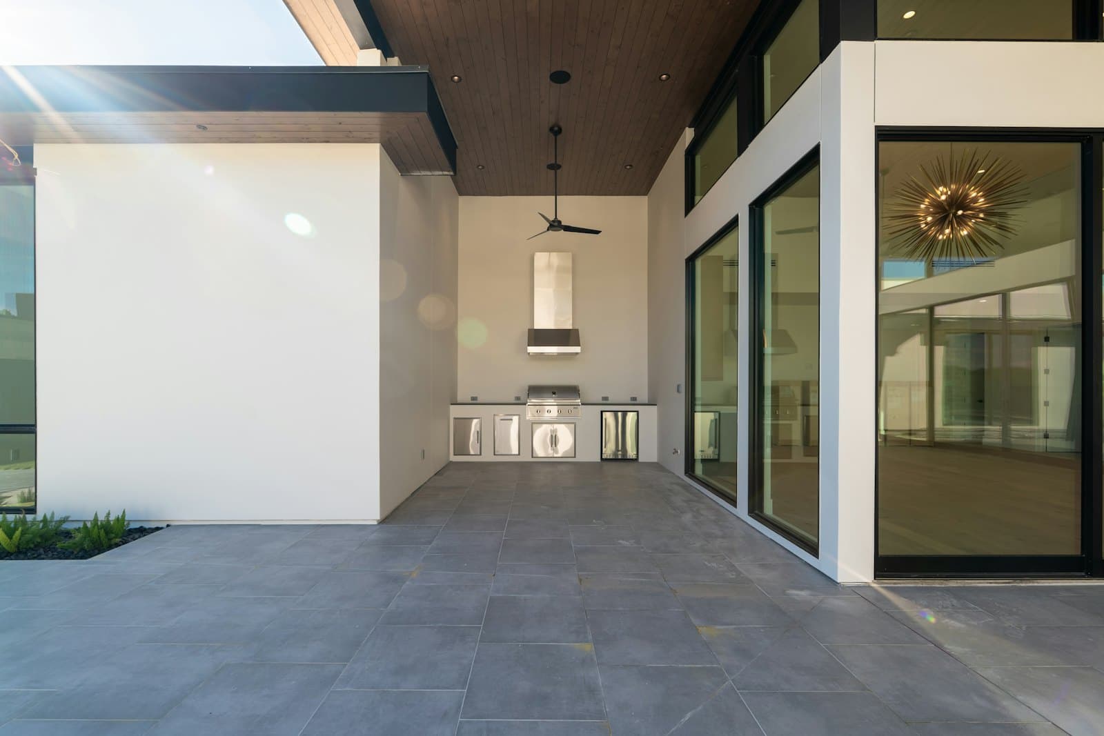 Modern outdoor patio with a built-in summer kitchen