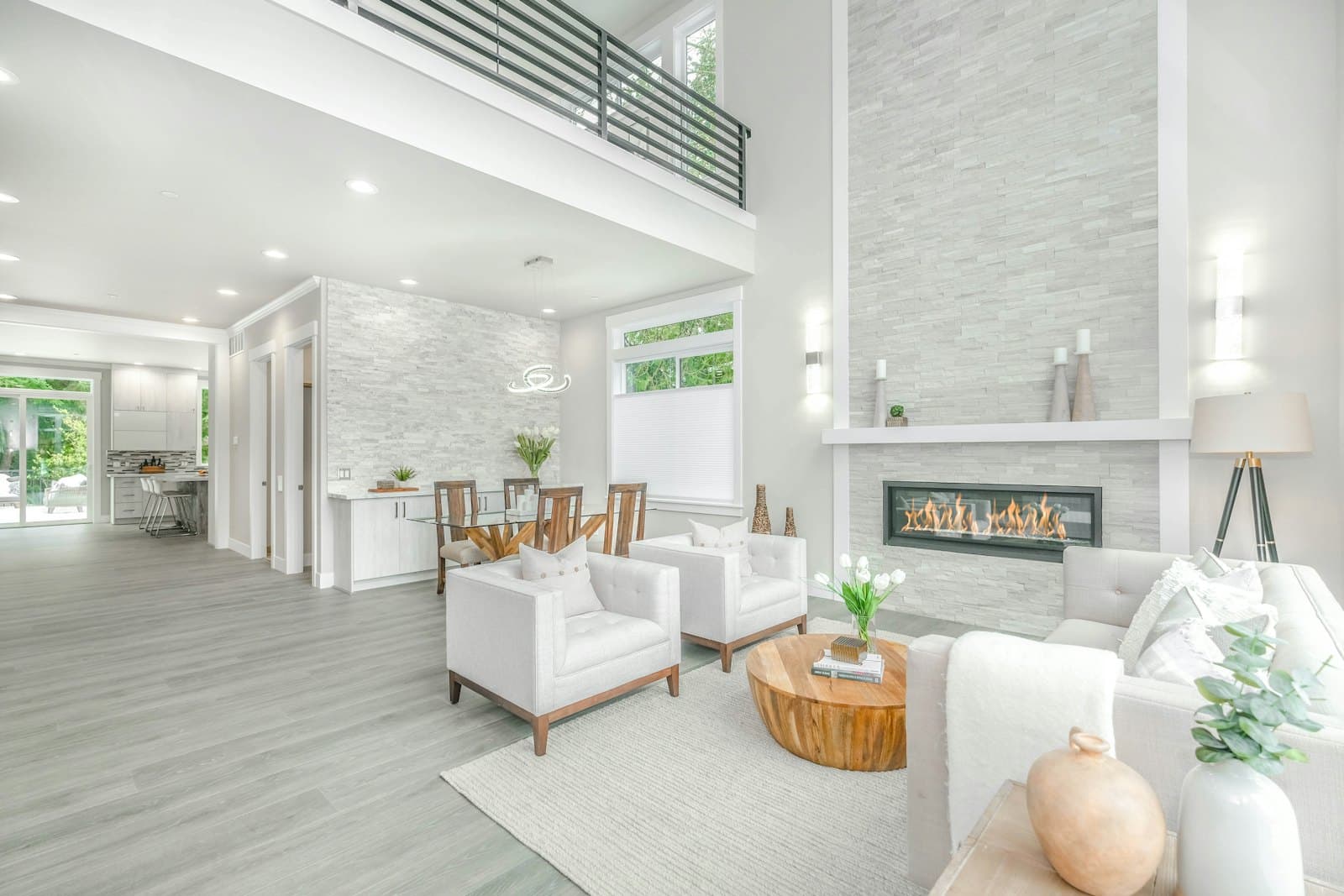 Open living area in a remodeled home with white and warm wood tones