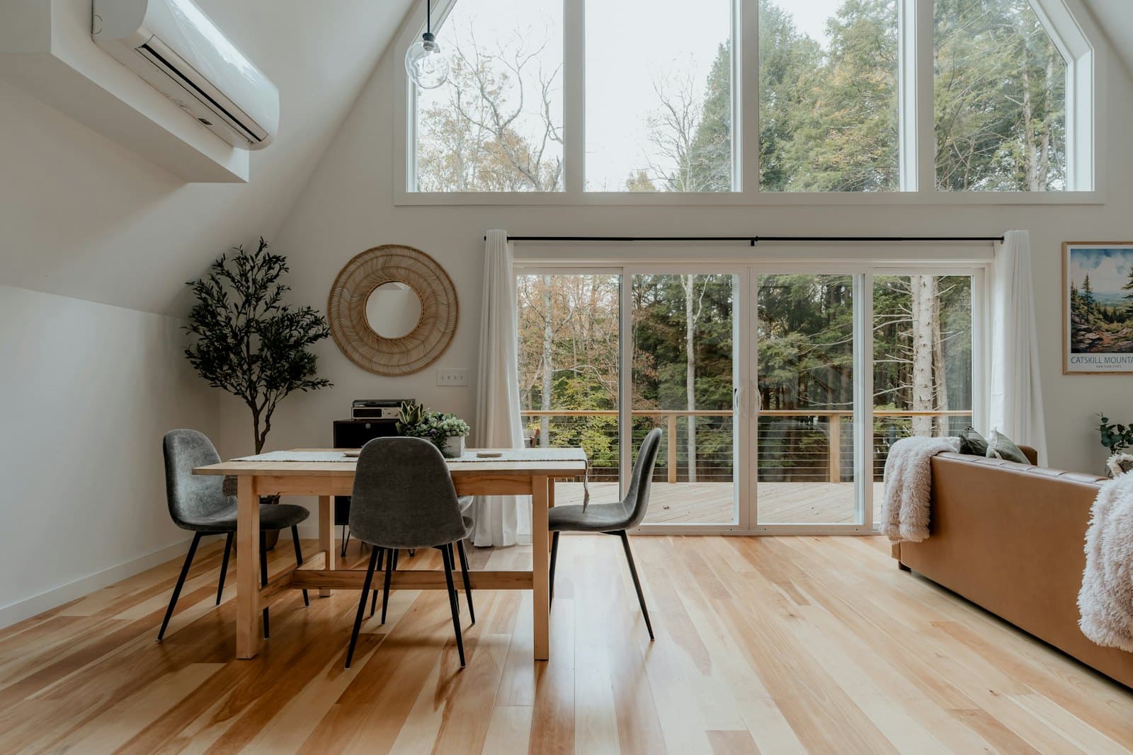 Living room with wood flooring and refreshed furnishings after a renovation